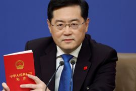 Chinese Foreign Minister Qin Gang holds a book of China's Constitution at a news conference on the sidelines of the National People's Congress (NPC) in Beijing, China March 7, 2023. REUTERS/Thomas Peter