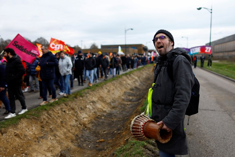 Protesters attend a demonstration against French government's pension reform plan in Pont-Audemer, as part of the sixth day of national strike and protests, in France, March 7, 2023. 