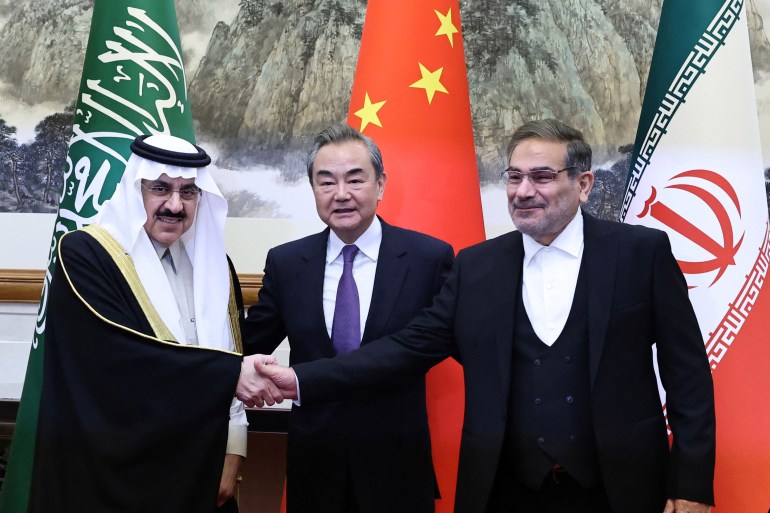 Wang Yi, a member of the Political Bureau of the Communist Party of China (CPC) Central Committee and director of the Office of the Central Foreign Affairs Commission, Ali Shamkhani, the secretary of Iran’s Supreme National Security Council, and Minister of State and national security adviser of Saudi Arabia Musaad bin Mohammed Al Aiban pose for pictures during a meeting in Beijing, China March 10, 2023.