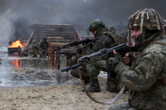 Ukrainian soldiers take part in a military drill on psychological combat training close to the border with Belarus, in Ukraine