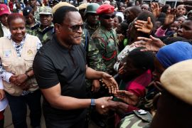 Malawi's President Lazarus Chakwera greets people after visiting flood victims at Queen Elizabeth Central hospital in Blantyre, Malawi,