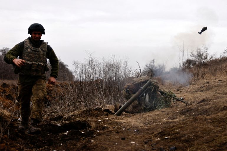 Ukrainian soldiers of the Paratroopers' of 80th brigade fire a mortar shell at a frontline position near Bakhmut, amid Russia's attack on Ukraine, in Donetsk region, Ukraine March 16, 2023. REUTERS/Violeta Santos Moura TPX IMAGES OF THE DAY