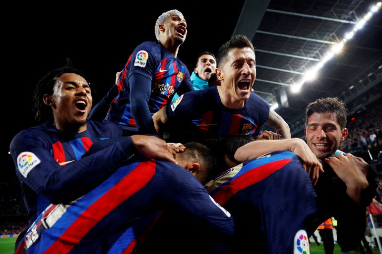 Barcelona's Franck Kessie celebrates scoring their second goal with Robert Lewandowski and teammates