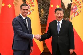 Chinese President Xi Jinping and Spanish Prime Minister Pedro Sanchez shake hands in Beijing [Moncloa Palace/Borja Puig de la Bellacasa/Handout via Reuters]