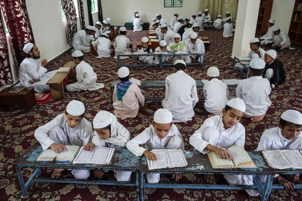 Young students along with their teachers memorise Quran in a madrasa in New Delhi. Some of these students have completely memorised the Quran, and they are sent to different mosques in Delhi to lead and recite the Quran during special late-night prayers offered only during Ramadan.