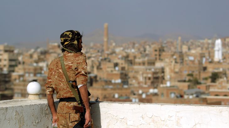 A member of Huthi-affiliated security forces looks on in the old city of the rebel-held Yemeni capital Sanaa