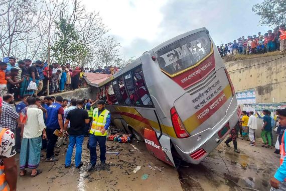 People gather after a bus met with an accident