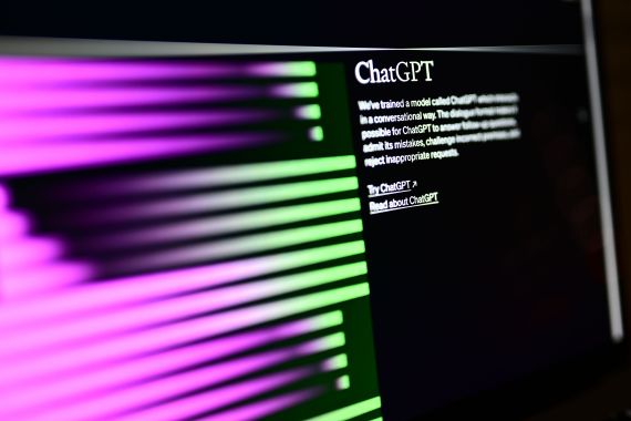 A computer screen with the home page of the artificial intelligence OpenAI web site, displaying its chatGPT robot.