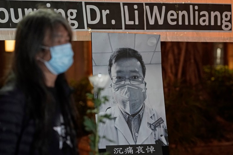 Pro-democracy activist Leung Kwok-hung, wearing a mask, attends a vigil for Chinese doctor Li Wenliang, in Hong Kong, Friday, Feb. 7, 2020. The death of a young doctor who was reprimanded for warning about China's new virus triggered an outpouring Friday of praise for him and fury that communist authorities put politics above public safety. (AP Photo/Kin Cheung)