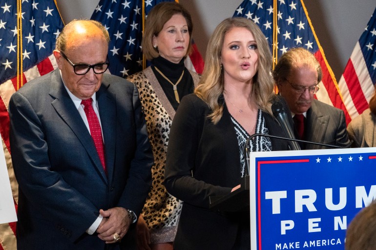 Members of President Donald Trump's legal team, including former Mayor of New York Rudy Giuliani, left, Sidney Powell, and Jenna Ellis, speaking, attend a news conference at the Republican National Committee headquarters, Thursday Nov. 19, 2020, in Washington