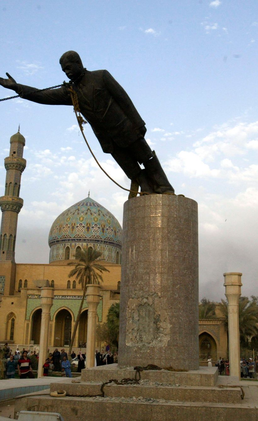 Saddam Hussein being toppled in downtown