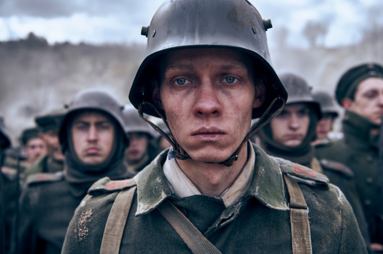 A boy, played by Felix Kammerer, stares aimlessly, wearing a German World War I uniform.