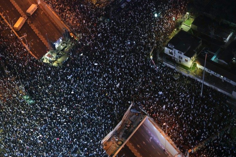 Tens of thousands of Israelis protest against plans by Prime Minister Benjamin Netanyahu's new government to overhaul the judicial system, in Tel Aviv, Israel, Saturday, March 4, 2023. (AP Photo/Tsafrir Abayov)