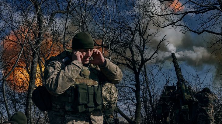 Ukrainian soldiers fire a self-propelled howitzer towards Russian positions near Bakhmut, Donetsk region