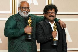 M.M. Keeravaani, left, and Chandrabose, winners of the award for best original song for "Naatu Naatu" from "RRR", pose in the press room at the Oscars