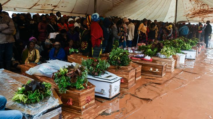 People attend the burial ceremony of some of the people who lost their lives following heavy rains caused by Cyclone Freddy in Blantyre, southern Malawi