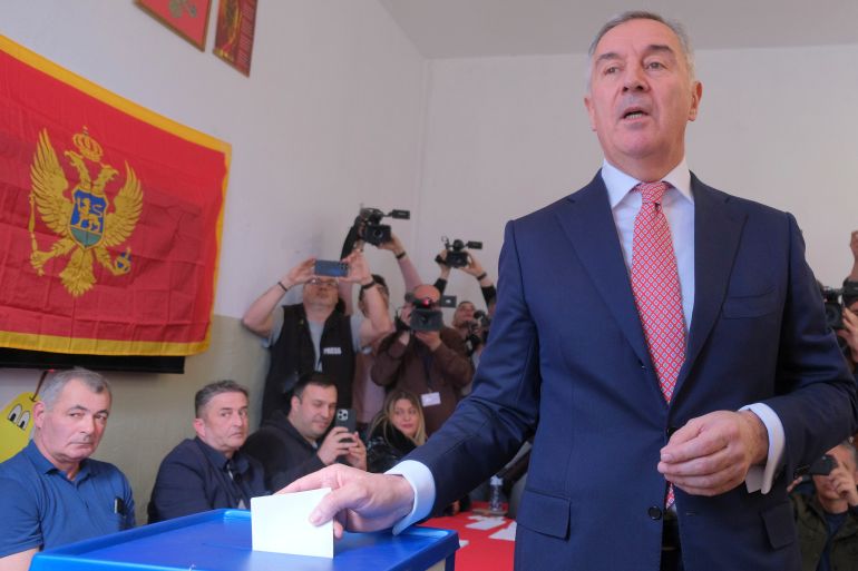 Pro-Western incumbent Milo Djukanovic casts his ballot at the polling station in Montenegro's capital Podgorica, Sunday, March 19, 2023. Voters in Montenegro are casting ballots Sunday in a presidential election marked by political turmoil and uncertainty over whether the small NATO member state in the Balkans will unblock its bid to join the European Union or seek to improve ties with Serbia and Russia. (AP Photo/Risto Bozovic)