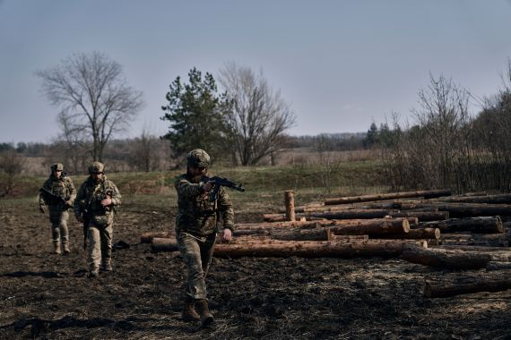 Ukrainian soldiers of the 28th brigade are seen on the frontline during a battle with Russian troops near Bakhmut, Donetsk region, Ukraine, Friday, March 24, 2023. (AP Photo/Libkos)