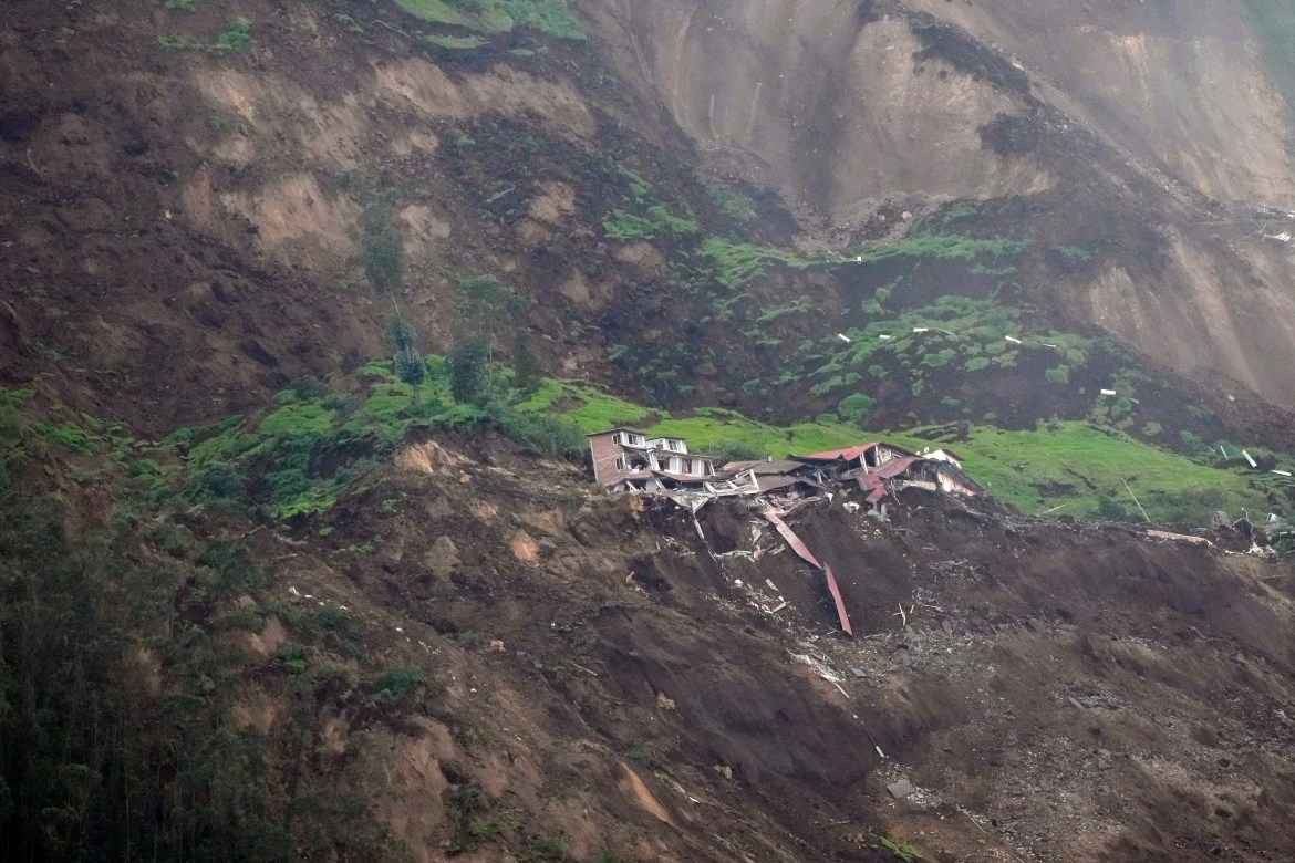 Homes are destroyed after a deadly landslide that buried dozens of homes in Alausi, Ecuador