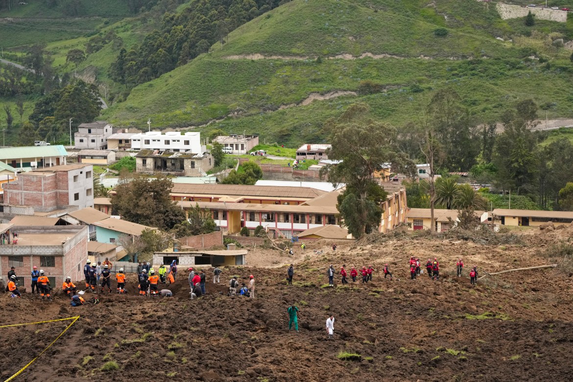 Rescue work is carried out at the site of a deadly landslide that buried dozens of homes in Alausi, Ecuador