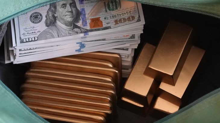Image showing stacks of dollars and gold bars.