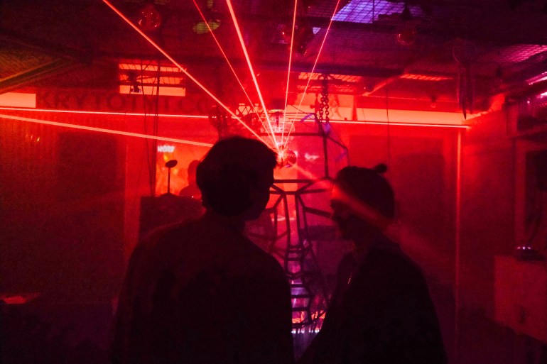 A photo of lasers and lighting in a music event.