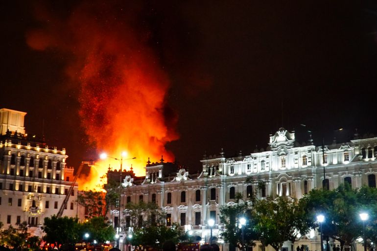 A colonial building in central Lima, Peru, burns in January after large anti-government protests which have roiled the countryside made their way to the capital