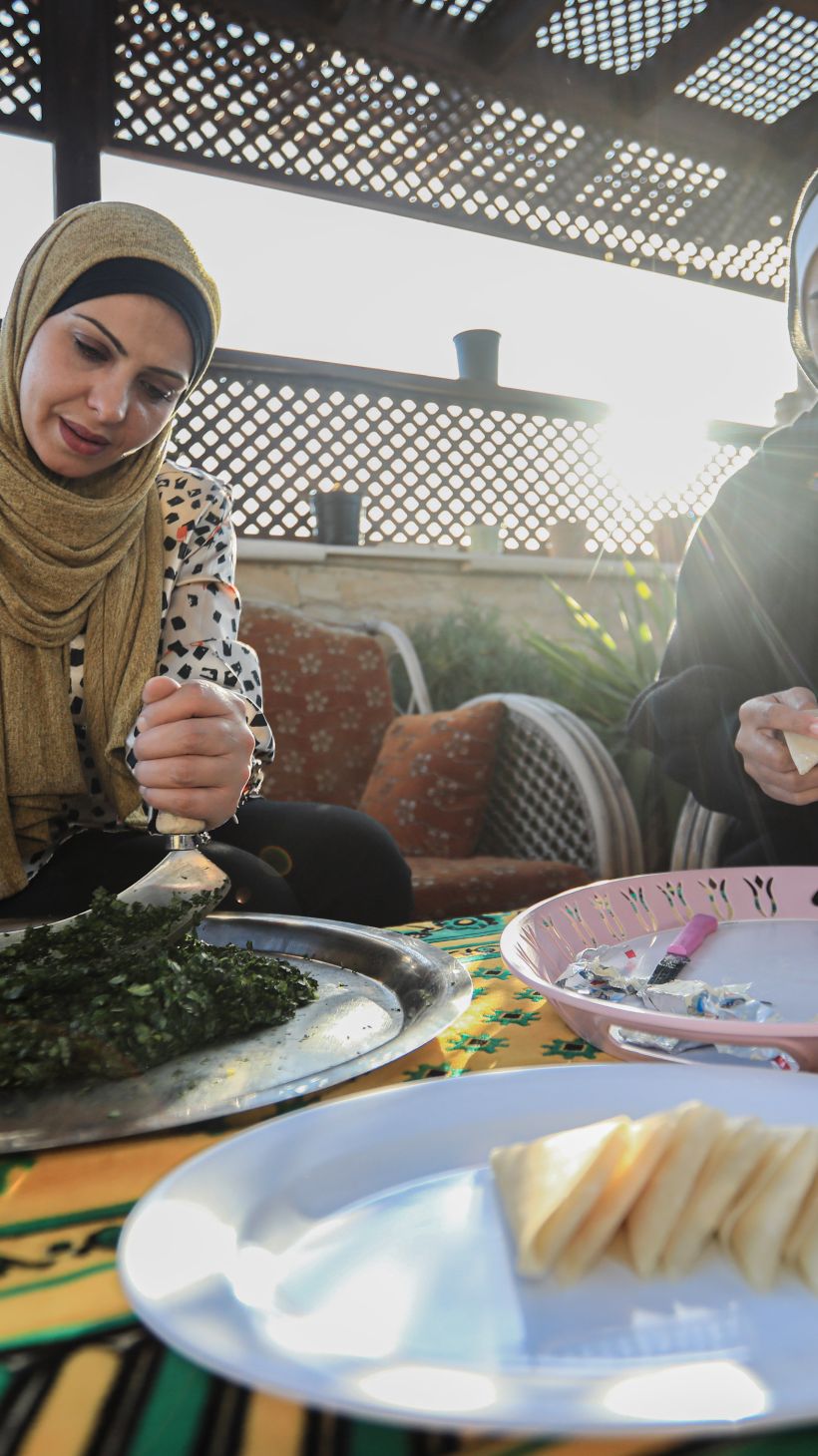 Siham Abu Shaaban and her mother prepare molokia and other iftar dishes