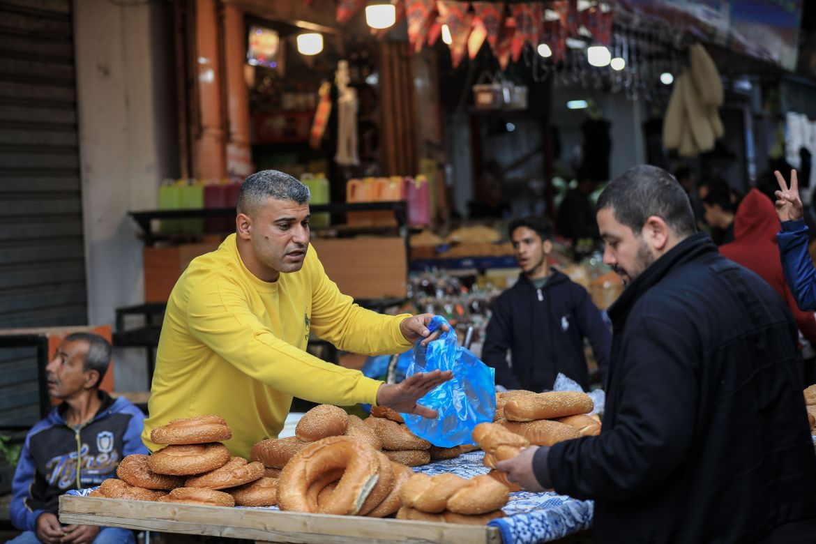 Ka’ak Vendor Mohammad Beltagy, 42, from Gaza and supports six children, works in selling Kaak (kaak bi ajwa means date paste filled cookies served traditionally in Eid) in the Zawiya market in east of Gaza. He also sells Kaak seasonally during the holy month of Ramadan.