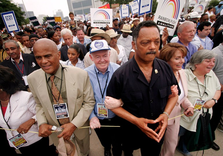 Harry Belafonte with Jesse Jackson during a march