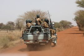 Soldiers from Burkina Faso patrol on the road of Gorgadji in sahel area, Burkina Faso March 3, 2019 [File: Luc Gnago/Reuters]