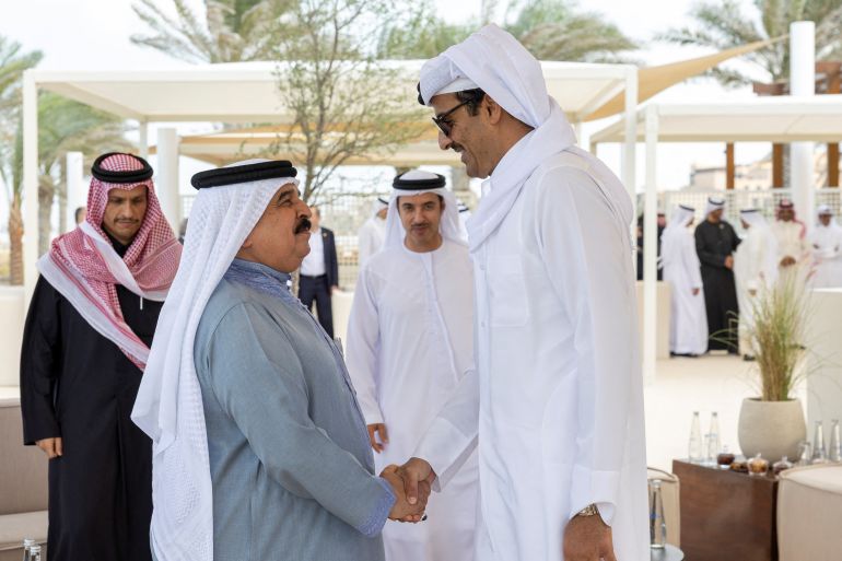 King of Bahrain Hamad bin Isa Al Khalifa greets Emir of Qatar Sheikh Tamim bin Hamad Al Thani