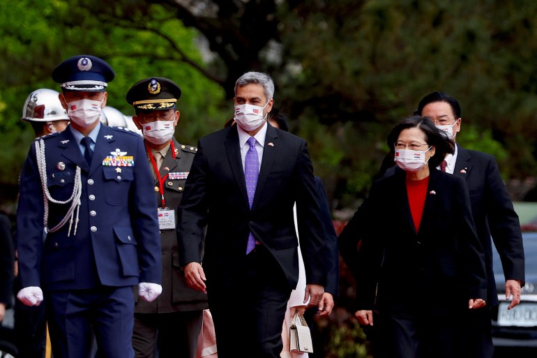 President Tsai Ing-wen walks beside President Mario Abdo Benitez in Taipei