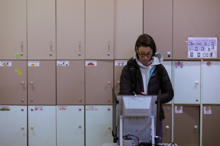A woman votes during the parliamentary election, in Sofia, Bulgaria, April 2, 2023. 