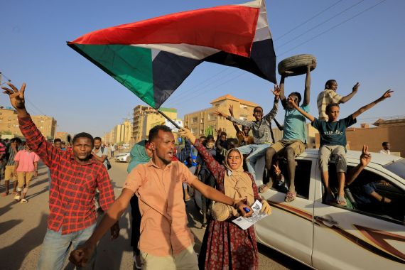 Protesters march during a rally marking the anniversary of the April uprising, in Khartoum, Sudan.