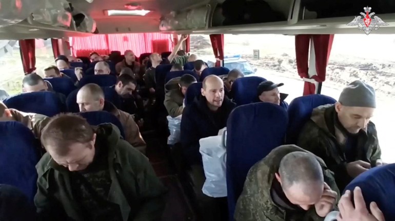 A still image from video, released by Russia's Defence Ministry, shows what it said to be captured Russian service personnel in a bus following the latest exchange of prisoners of war at an unknown location in the course of Russia-Ukraine conflict, in this image taken from handout footage released April 10, 2023. Russian Defence Ministry/Handout via REUTERS ATTENTION EDITORS - THIS IMAGE WAS PROVIDED BY A THIRD PARTY. NO RESALES. NO ARCHIVES. MANDATORY CREDIT. WATERMARK FROM SOURCE