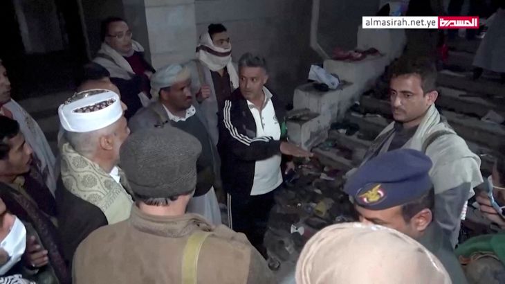 Officials visit the site after a stampede in Sanaa