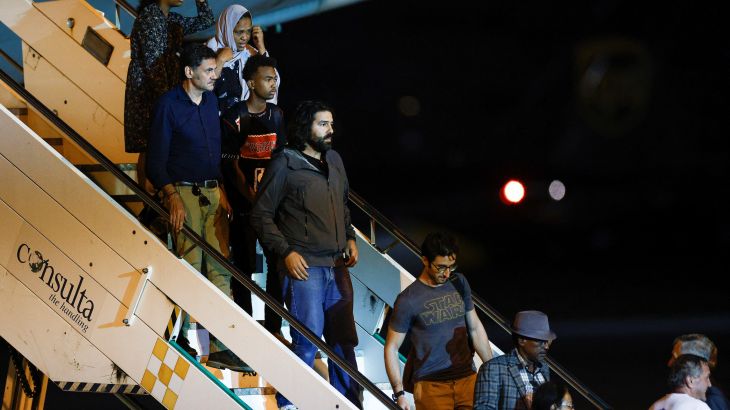Evacuees from war-torn Sudan leave an Italian military plane upon their arrival at Ciampino airport near Rome, Italy.