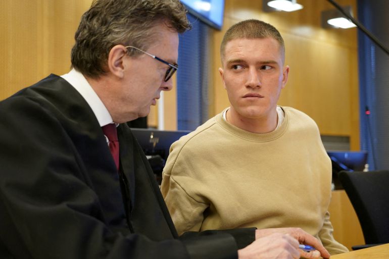 The supposed Wagner defector Andrei Medvedev and his defender Brynjulf Risnes talk in the Oslo district court, as Medvedev is accused of having participated in a fight outside a pub in the center of Oslo and of violence against the police, April 25, 2023, in Oslo, Norway. NTB/via REUTERS ATTENTION EDITORS - THIS IMAGE WAS PROVIDED BY A THIRD PARTY. NORWAY OUT. NO COMMERCIAL OR EDITORIAL SALES IN NORWAY. REFILE - CORRECTING CITY