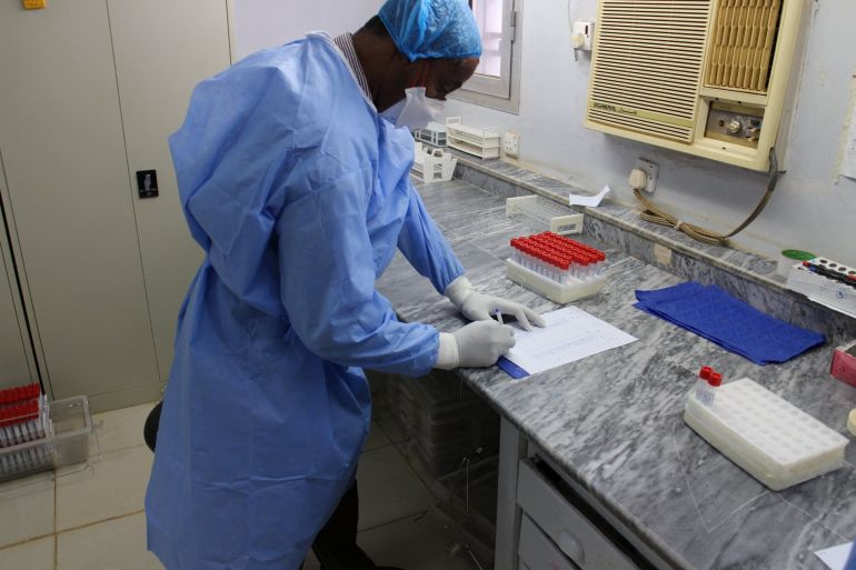A staff member works at National Public Health Laboratory in Khartoum, Sudan in this undated image posted to social media on December 31, 2020. National Public Health Laboratory - Sudan/Handout via REUTERS THIS IMAGE HAS BEEN SUPPLIED BY A THIRD PARTY. NO RESALES. NO ARCHIVES