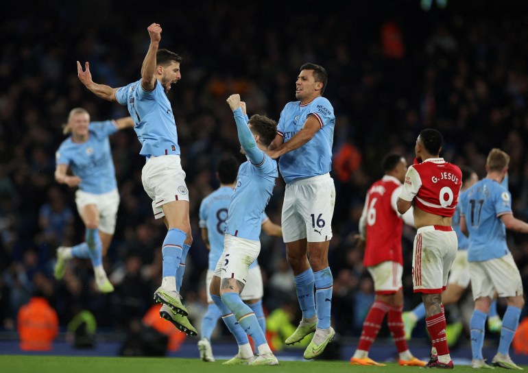 Man City celebrate beating Arsenal 4-1