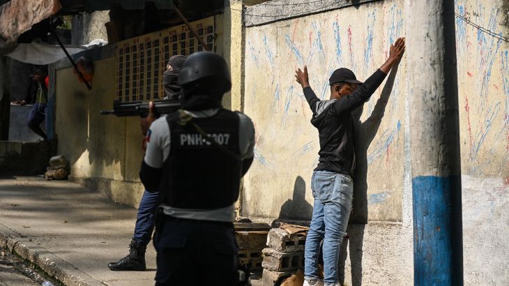 A man is under arrest by Haitian police in the Turgeau commune of Port-au-Prince, Haiti, during gang-related violence on April 24, 2023.