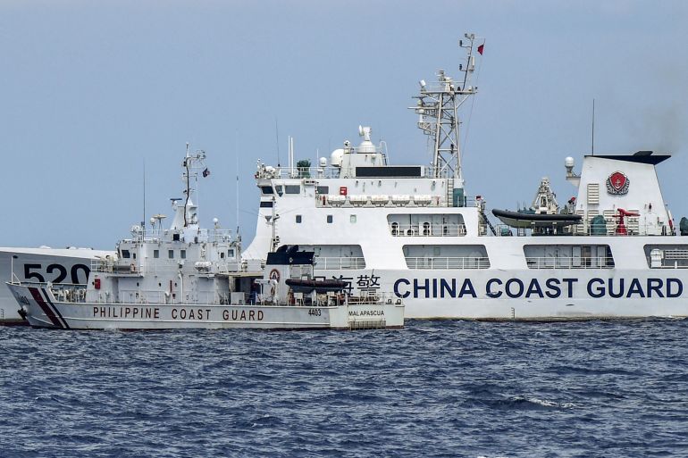A Philippine coast guard vessel in a near collision with a Chinese coast guard ship in the South China Sea. Both vessels are clearly marked. The Chinese ship is far bigger than the Philippines one and cutting into its path.