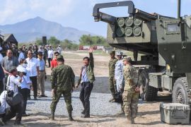 Ferdinand Marcos Jr waves after inspecting a HIMARS air defence system during the Balikatan joint exercises between the US and the Philippines.