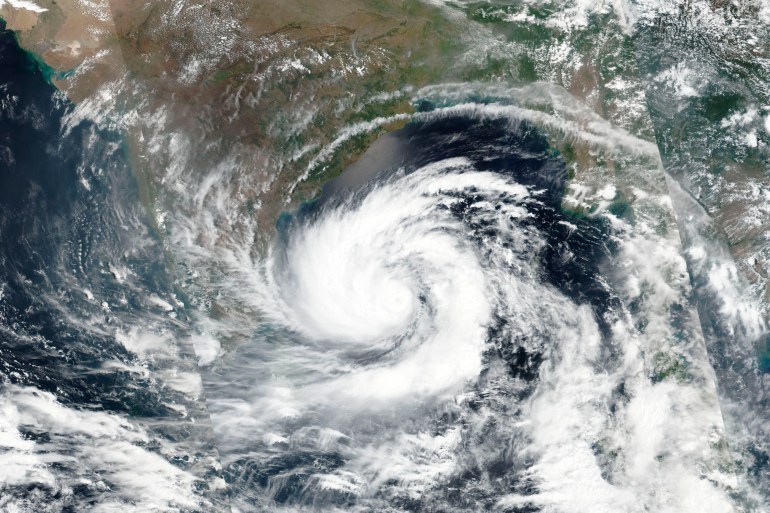 This May 17, 2020, satellite image released by NASA shows Cyclone Amphan over the Bay of Bengal in India. Amphan has intensified into a super cyclone and expected to make a landfall near Sundarbans, south of Kolkata, on Tuesday evening, May 19, 2020. A red alert has been initiated to sea bound fishermen and disaster management teams started evacuating villagers from the sea front. (NASA Worldview, Earth Observing System Data and Information System (EOSDIS) via AP)