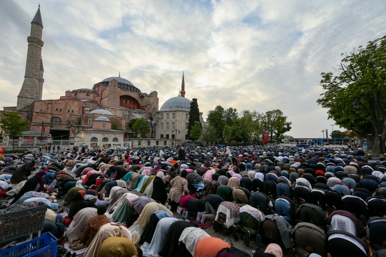 Muslims offer prayers during the first day of Eid al-Fitr, which marks the end of the holy month of Ramadan, outside the iconic Haghia Sophia Mosque in Istanbul, Turkey, May 2, 2022 [File: Emrah Gurel/AP Photo]