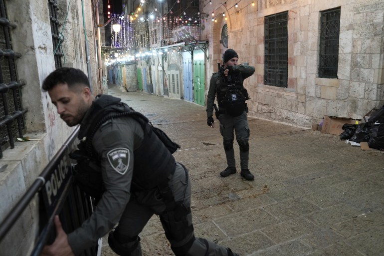 Israeli paramilitary Border Police close a path leading to the Al-Aqsa Mosque compound after shots were fired in the Old City of Jerusalem during the Muslim holy month of Ramadan, Saturday, April 1, 2023