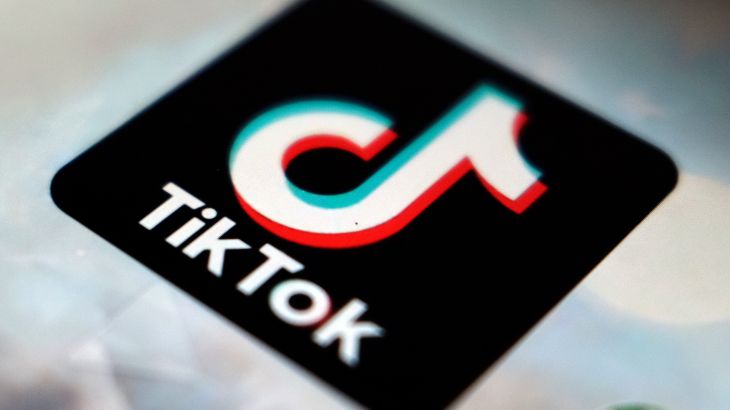 A close-up of the black TikTok logo, with its variation on a musical note