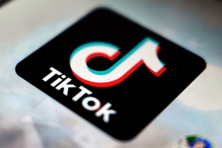 A close-up of the black TikTok logo, with its variation on a musical note