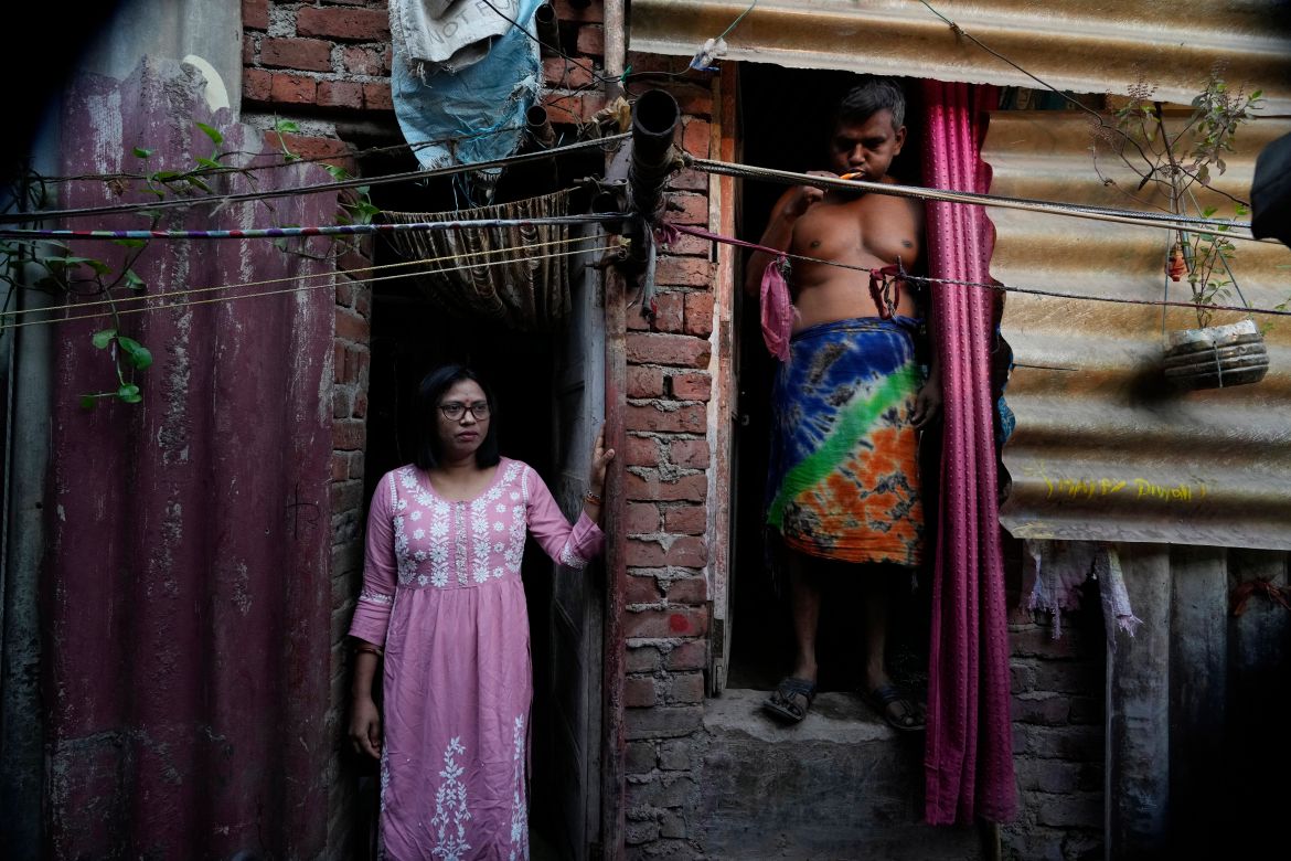 Lalmani Chauhan stands at her residence in a slum in Mumbai,